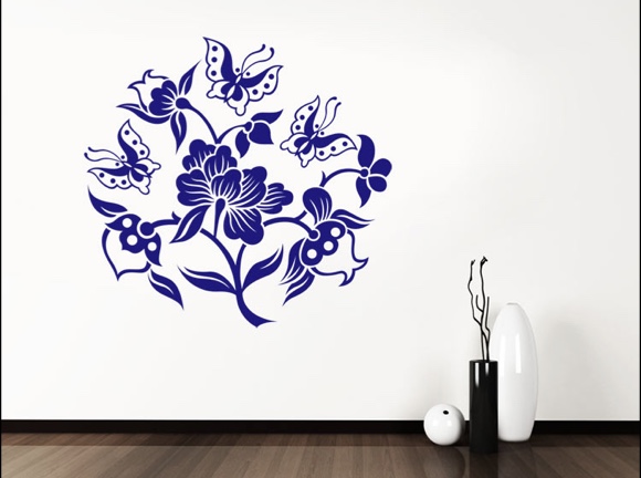 Drei Schmetterlinge auf Blütenzweig